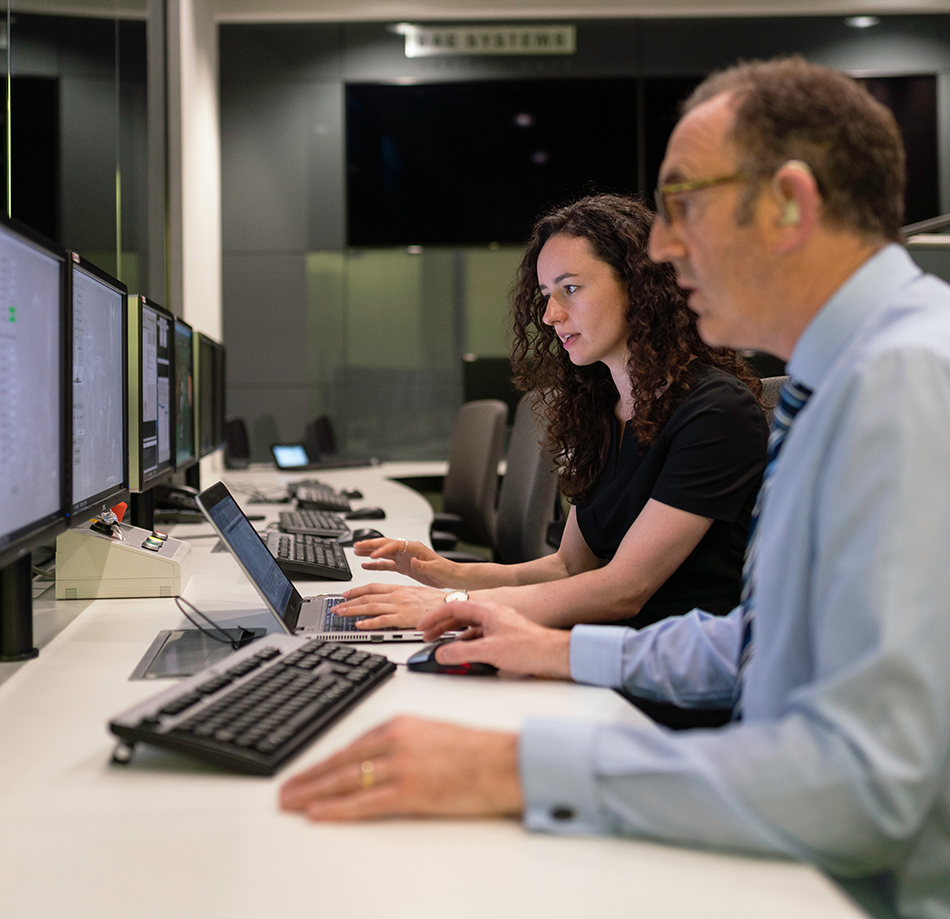 Man and Woman Working in Office